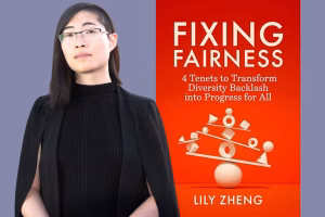 A person with straight dark hair, glasses, and a black outfit stands beside the orange cover of the book Fixing Fairness by Lily Zheng, which features geometric shapes balancing on a scale.