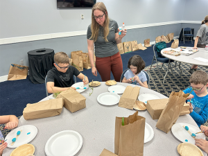 Dr. Andrea Darracq, Wildlife Biologist at Murray State University assists students with building a habitat for painted robin eggs.
