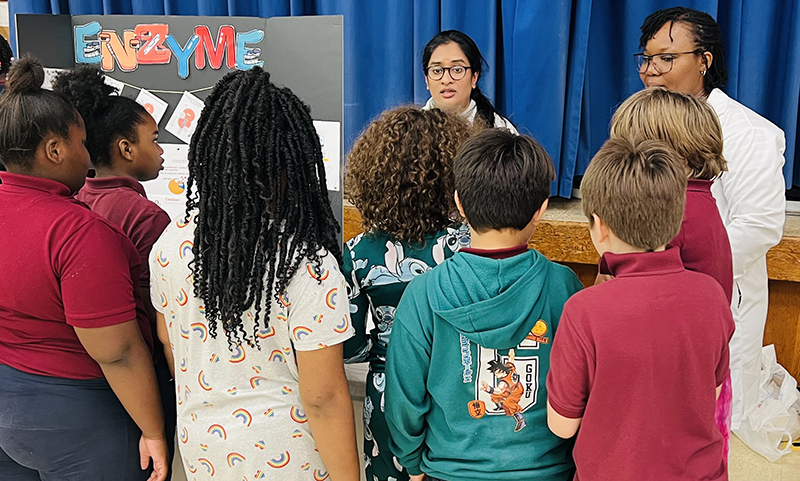 Elaine Nkwocha with her high school mentee as a STEM mentor with the LSU EnvironMentor program