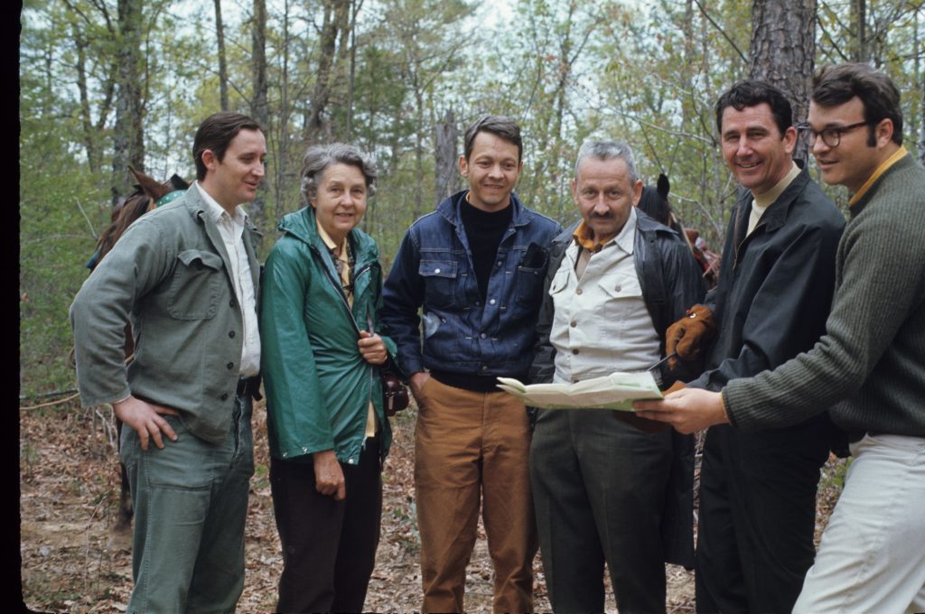 Dr. Quarterman outside at Savage Gulf guiding five men, one of whom is Governor Dunn.