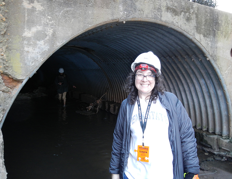 Laura Guertin about to enter a stormwater drainage tunnel in Raleigh, North Carolina, which set her on a path to further expand her science communication approach and toolkit.