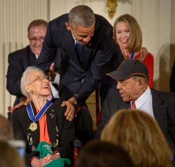 President Barack Obama presents former NASA mathematician Katherine Johnson with the Presidential Medal of Freedom, as professional baseball player Willie Mays, right, looks on, Tuesday, Nov. 24, 2015, during a ceremony in the East Room of the White House in Washington. Photo Credit: (NASA/Bill Ingalls)