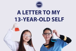 Two girls wearing safety goggles and lab coats hold up flasks with colored liquids (one red, one blue), smiling. Text above them reads, “A Letter to My 13-Year-Old Self.” AWIS logo is at the top.