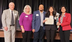 AWIS-NC Chapter President and NCSEF Volunteer Judge, Dr. Gauri Kulkarni, presenting Young STEM Star Award to Saumya Wagh