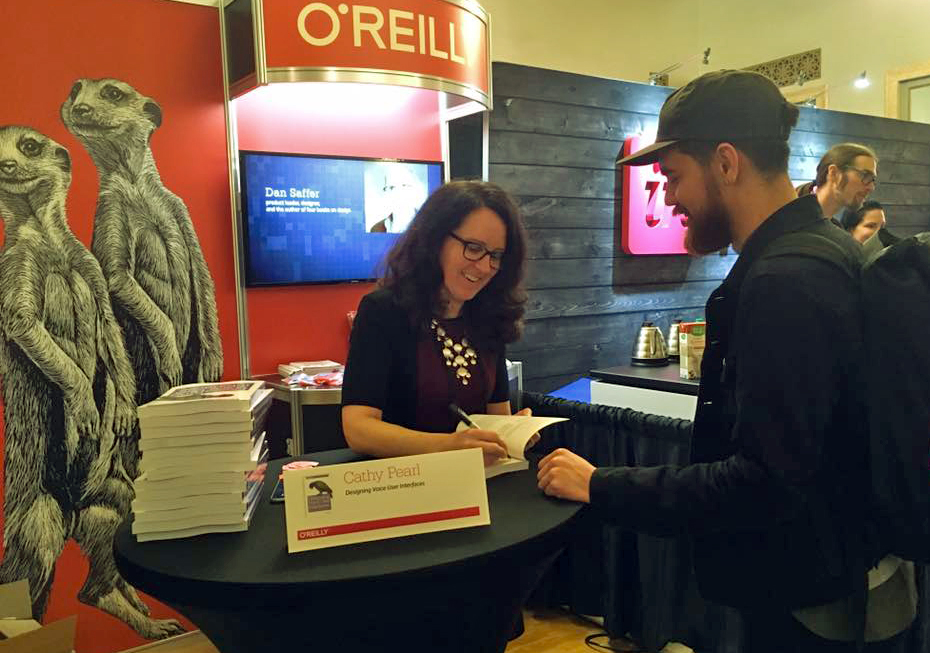 Cathy Pearl is signing books at the O'Reilly Design Conference.
