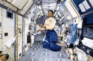 Mae Jemison floating in a space lab