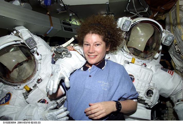 386562 02: Astronaut Susan J. Helms, STS-102 mission specialist, is pictured March 10, 2001 on the mid deck with both Extravehicular Mobility Unit (EMU) space suits designated for extravehicular activity (EVA). Helms is one of two astronauts assigned to space walk duties after the Space Shuttle Discovery and the International Space Station (ISS) link in Earth orbit. The photograph was recorded with a digital still camera. (Photo courtesy of NASA/Newsmakers). GETTY IMAGES.